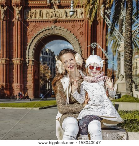 Mother And Child Near Arc De Triomf In Barcelona Handwaving
