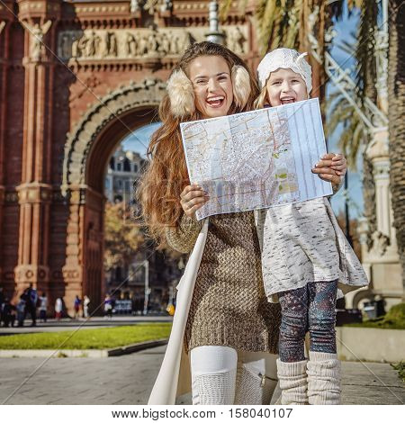 Mother And Daughter Near Arc De Triomf In Barcelona With Map