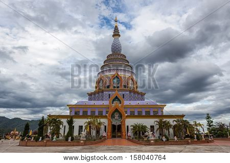 Wat Thaton Crystal Pagoda With Dramatic Cloudy Twilight Sky Above It In Mae Ai District, Chiang Mai