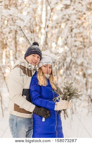 The Guy And The Girl Have A Rest In The Winter Woods.