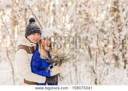The Guy And The Girl Have A Rest In The Winter Woods.