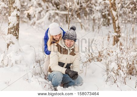 The Guy And The Girl Have A Rest In The Winter Woods.