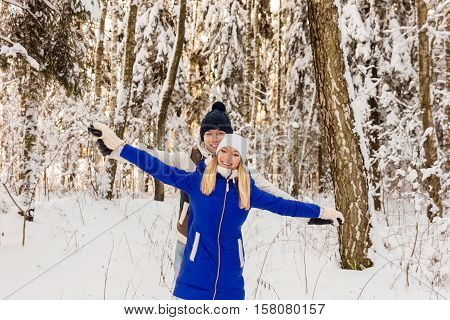 The Guy And The Girl Have A Rest In The Winter Woods.