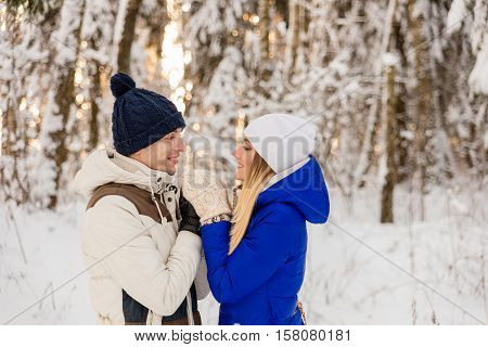 The Guy And The Girl Have A Rest In The Winter Woods.