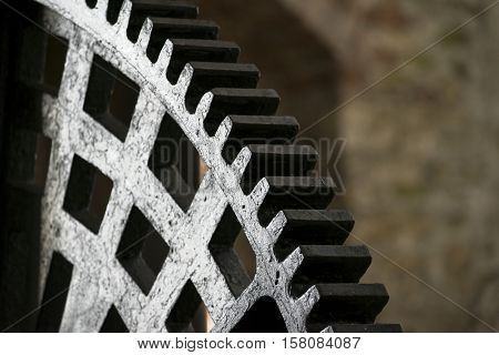 Huge steel toothed wheel. Close up photo