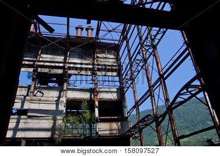 Abandoned, destroyed by war and overgrown machinery of Tkvarcheli power plant, Abkhazia, Georgia