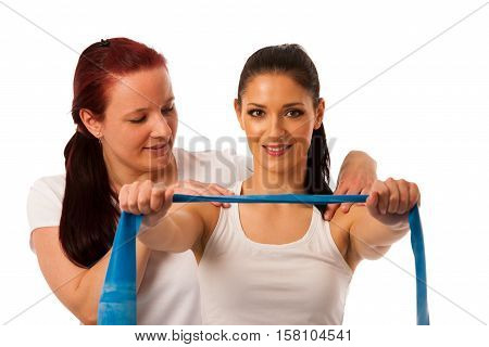 Physiotherapy - Therapist Doing Arm Strenghteninh Excercises With A Patient To Recover Strenght Afte