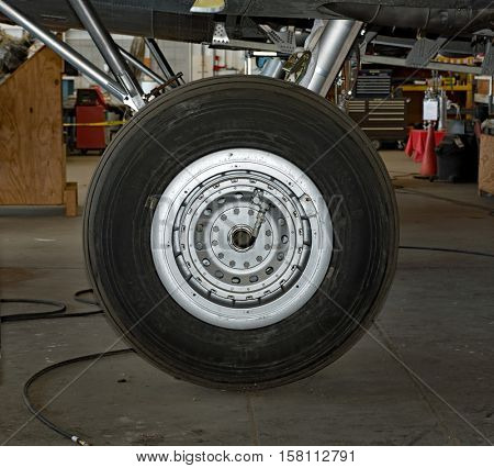 DAYTON, OHIO, USA - NOVEMBER 18, 2016: National Museum USAF is restoring the famous original WWII Memphis Belle B-17F Flying Fortress bomber, landing wheel close-up.