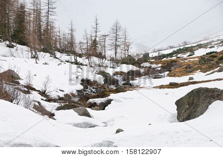 Scenic picture-postcard view of famous place, Grossglockner mountain with cloud & fog, Austria