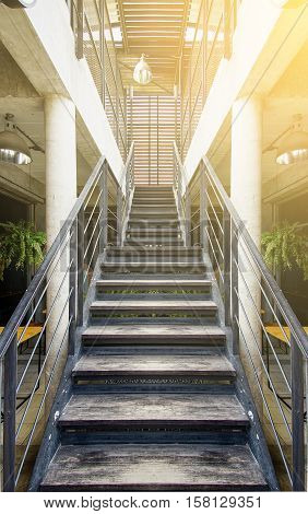 wooden stairs interior in the modern office in the morning light