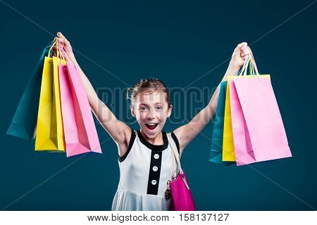 Girl Carrying Lots Of Shopping Bags