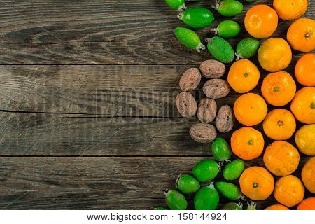Mixed exotic fruits on wooden background. Close up
