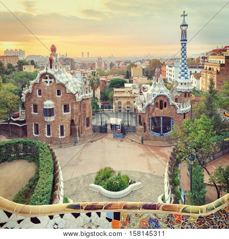 Park Guell in Barcelona. View to entrace houses with mosaics on foreground