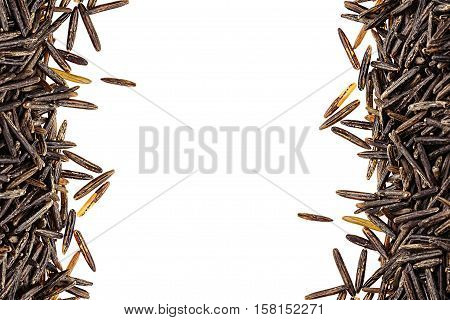 Border of black rice close-up on white background. Isolated. Decorative frame of wild brown unpolished rice.