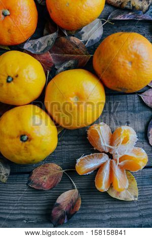 Fresh Mandarin Oranges Fruit With Leaves On Wooden Table.  Ripe