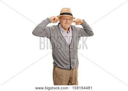 Mature man plugging his ears with his fingers isolated on white background