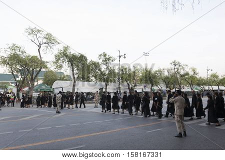 BANGKOK THAILAND - NOV 22 : walking of mourners queue up on Ratchadamnoen Nai road in sanam luang area for into Grand Palace while the funeral of king Bhumibol Adulyadej on november 22 2016