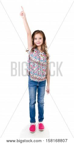 Cute little girl is pointing up isolated on a white