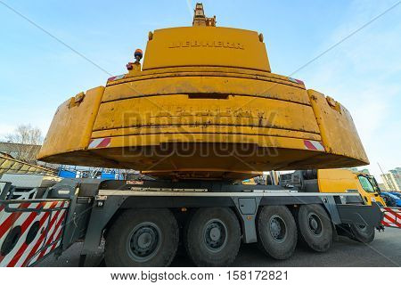 MOSCOW, RUSSIA - NOVEMBER 11, 2016: State Unitary Enterprise Mosvodostok performs recovery vessels on coastal winter parking. Counterbalance truck crane.