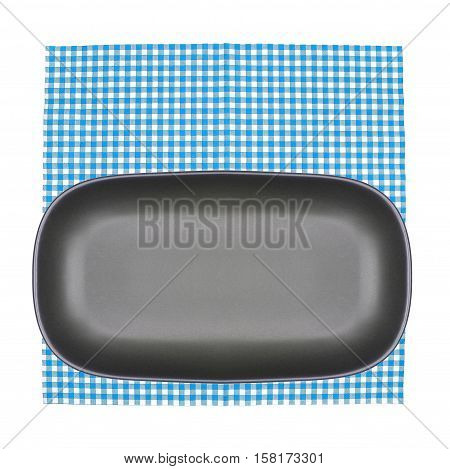 Top view plate on checkered tablecloth pattern background