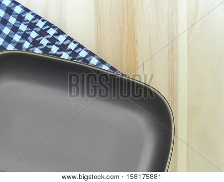 Top view plate on checkered tablecloth pattern background .Free space for products and for your text