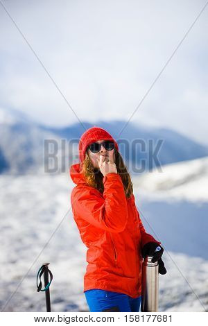 Girl Enjoys A Hygienic Lipstick In The Mountains.