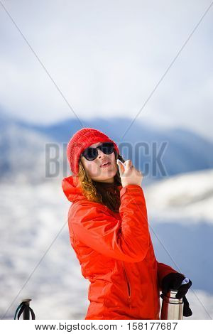 Girl Enjoys A Hygienic Lipstick In The Mountains.
