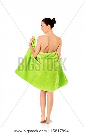 Young beautiful woman after bath full portrait isolated over white.