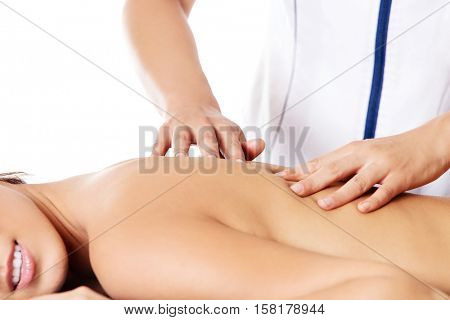 Woman having massage of body in the spa salon. Beauty treatment concept.