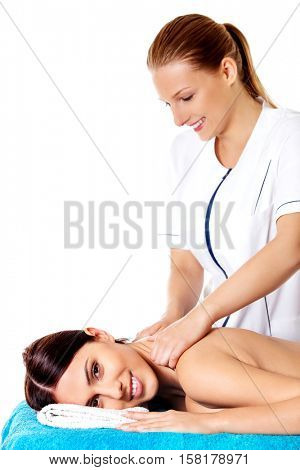 Woman having massage of body in the spa salon. Beauty treatment concept.