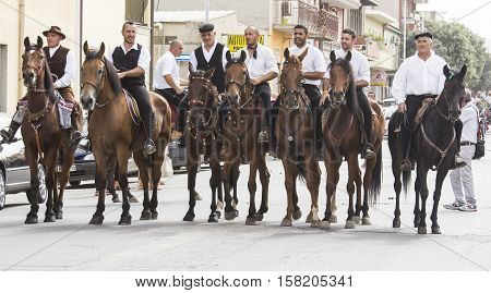 QUARTU S.E., ITALY - September 21, 2014: Parade of Sardinian costumes and floats for the grape festival in honor of the celebration of St. Helena. - Sardinia