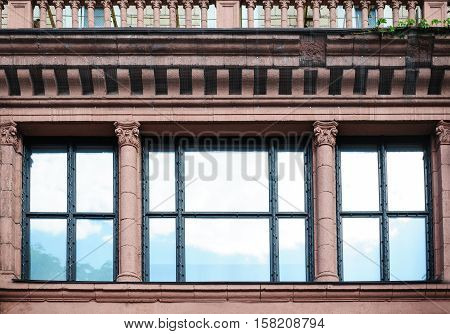 facade architectural building with Windows and columns.
