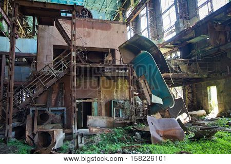 Abandoned, destroyed by war and overgrown machinery of Tkvarcheli power plant, Abkhazia, Georgia