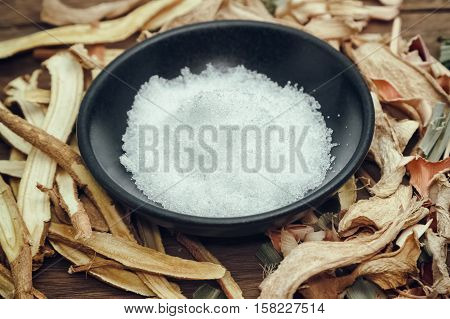 Borneol camphor in black bowl althernative medicine