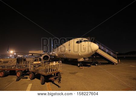 Passenger Airplane at the terminal gate, prepare and maintenance aircraft for night flight