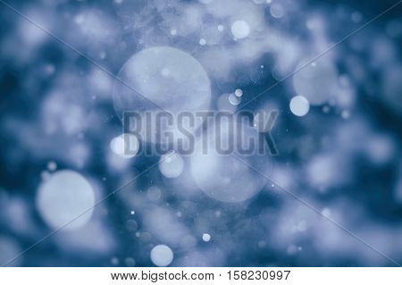 Abstract Festive background. Glitter vintage lights background with lights defocused. Christmas and New Year feast bokeh background with copyspace.