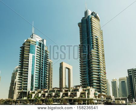 DUBAI UAE - NOVEMBER 7 2016: Luxury scyscrapers in center of Dubai Unidet Arab Emirates. Dubai Marina in a summer day United Arab Emirates.