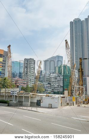 Modern Skyscrapers And Construction Works On The Road In Kowloon