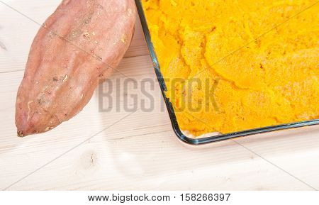 Oven Meal With Sauerkraut And Sweet Potato On Wooden Background