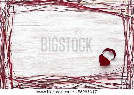 Frame for valentine's day, Birthday, Mother's Day, Wedding Day . Top view with copy space. Photos for posts, blogs, advertising and news. White wooden background with frame. Greeting concept card