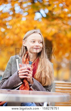 Girl Drinking Hot Wine In A Cafe