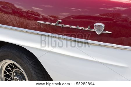 BRISBANE, AUSTRALIA - November 20, 2016: Detail of the rear side badge of the 1958 Holden FC series an automobile produced by Holden in Australia