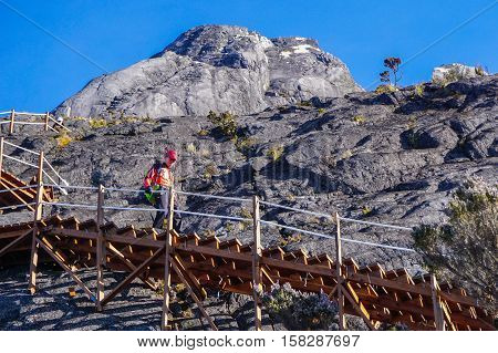 Ranau,Sabah,Malaysia-March 13,2016:Climber moving down to Laban Rata after successfully conquering the Mountain Kinabalu.Climbing season officially start on Dec 1,2015 after closure due to earthquake