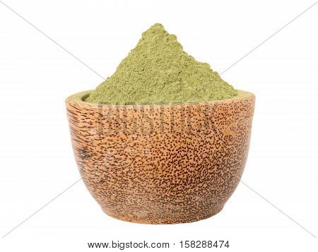 Indigo indigofera tinctoria powder in the coconut bowl isolated on white