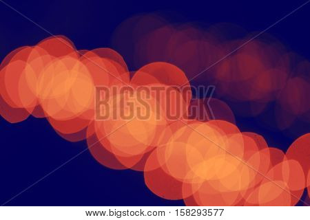 Abstract colorful blurry background cold and warm colors tone cinematic effect evening night street romantic lights