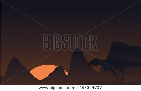 Silhouette of mapusaurus on brown sky landscape vector