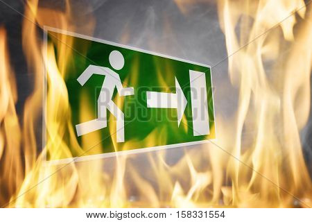 Close-up Of Emergency Fire Exit Board Burning In The Fire Flame