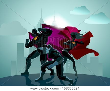 Superhero Team; Team of superheroes posing in front of a light.