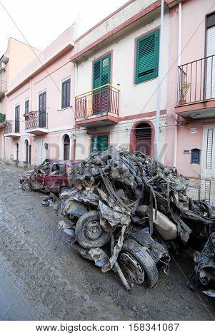 Scaletta Marina, Italy - October 3 2009. A landslide has invaded the Sicilian town causing many deaths. The collapse of a mountain caused hundreds of tons of earth and rock fell on buildings and cars.