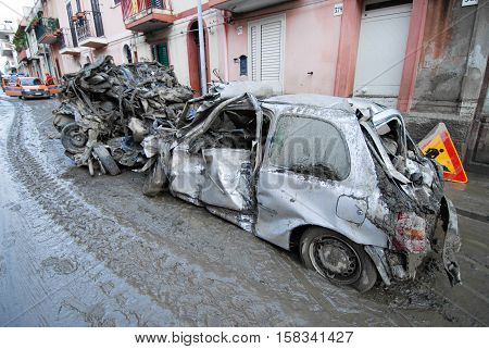 Scaletta Marina, Italy - October 3 2009. A landslide has invaded the Sicilian town causing many deaths. The collapse of a mountain caused hundreds of tons of earth and rock fell on buildings and cars.